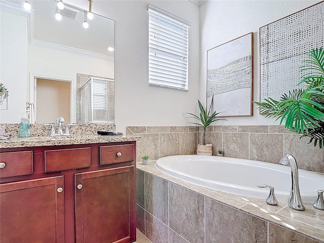 full bath with a bath, a stall shower, vanity, and ornamental molding