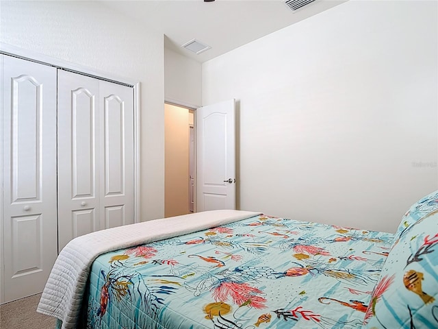 bedroom with a closet and carpet flooring