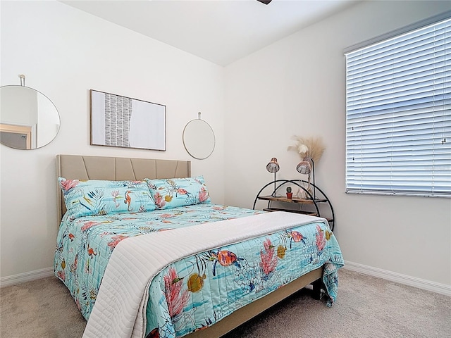 carpeted bedroom featuring baseboards