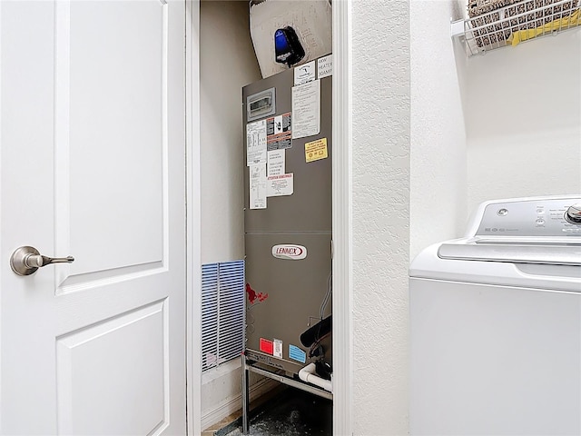 washroom with heating unit, washer / dryer, and laundry area