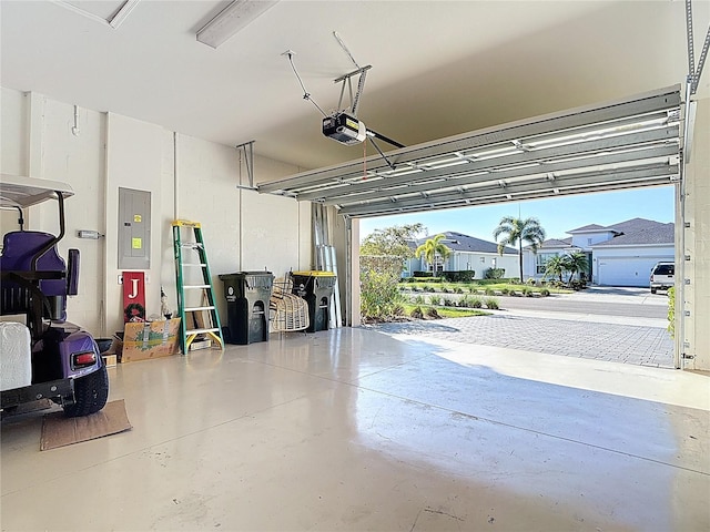 garage featuring electric panel and a garage door opener