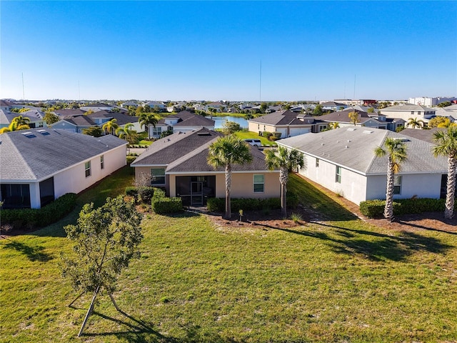 birds eye view of property with a residential view