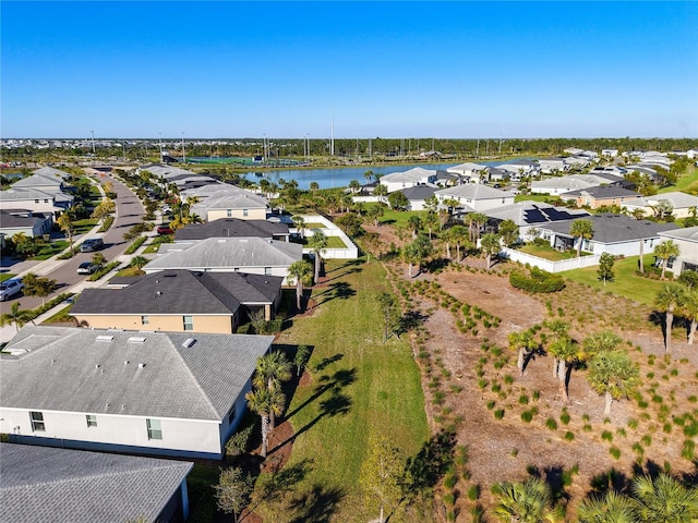 birds eye view of property featuring a residential view and a water view