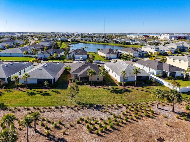 bird's eye view with a residential view and a water view