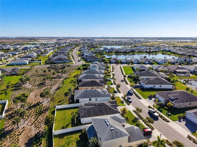 bird's eye view featuring a residential view and a water view