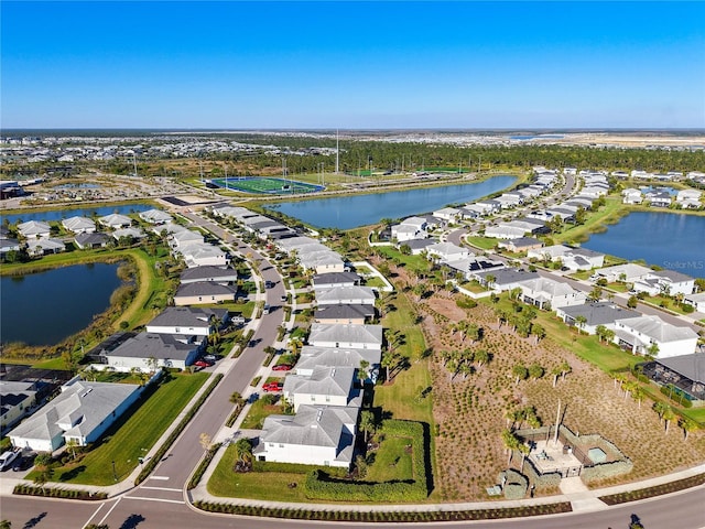 birds eye view of property featuring a water view and a residential view