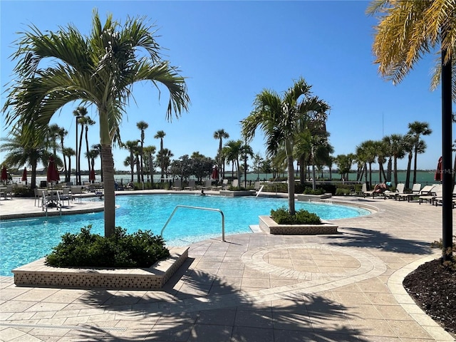 community pool with a patio area