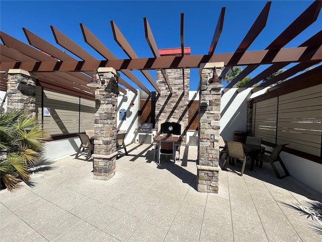 view of patio / terrace with a grill, exterior kitchen, outdoor dining space, and a pergola
