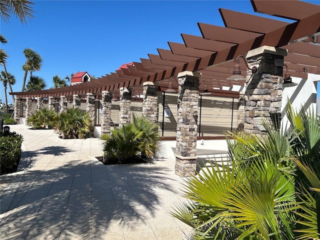 view of home's community featuring a pergola