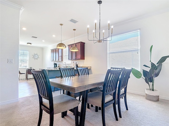 dining area with light carpet, visible vents, ornamental molding, and an inviting chandelier