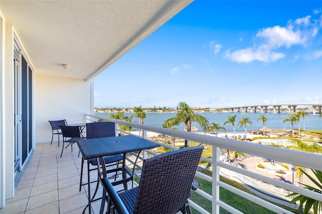 balcony featuring a water view