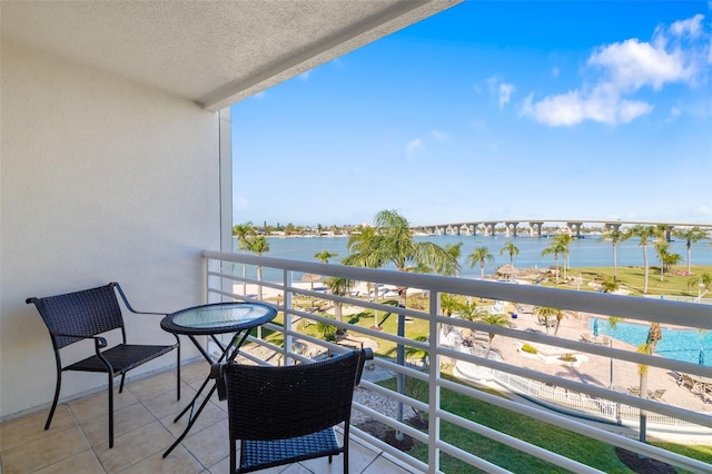 balcony featuring a water view