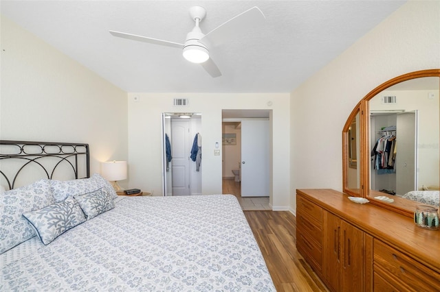 bedroom featuring a spacious closet, visible vents, and a closet