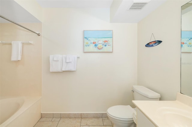 bathroom featuring tile patterned flooring, visible vents, baseboards, a washtub, and toilet