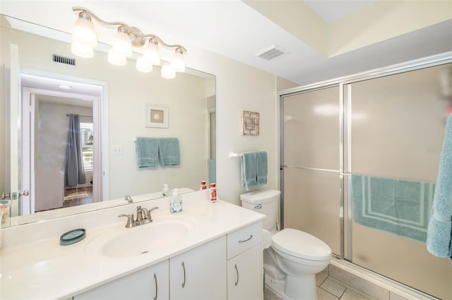 bathroom featuring visible vents, toilet, an enclosed shower, and vanity