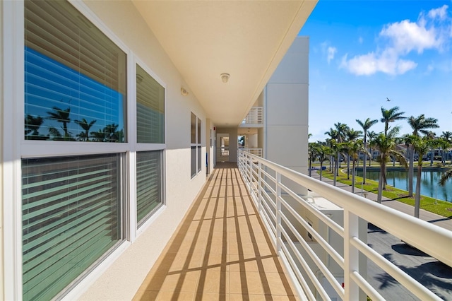 balcony featuring a water view