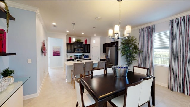 dining room featuring a notable chandelier, recessed lighting, crown molding, and baseboards