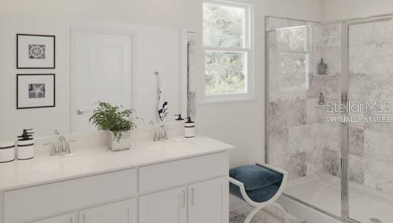 full bathroom with vanity and a stall shower