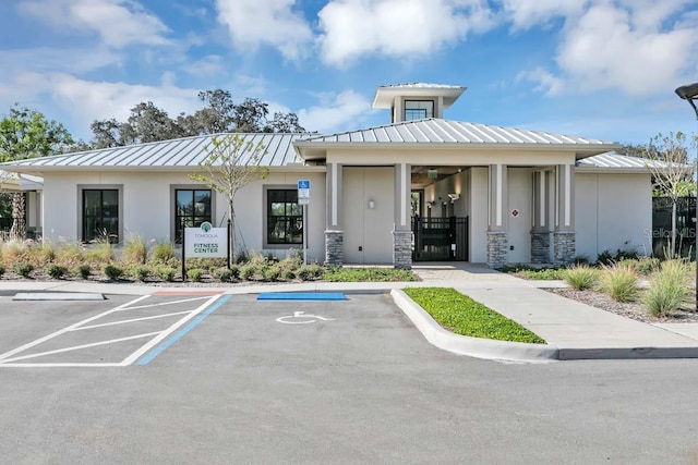 view of building exterior with uncovered parking