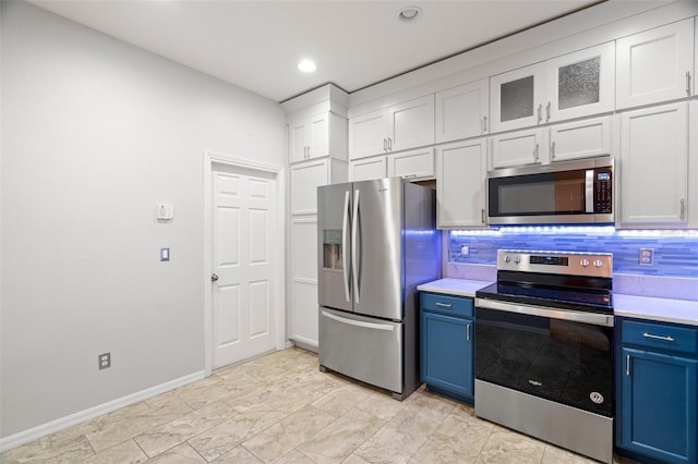 kitchen with blue cabinets, stainless steel appliances, and light countertops