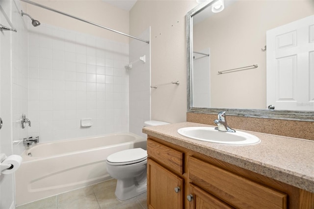 bathroom with vanity, tile patterned floors, toilet, and washtub / shower combination