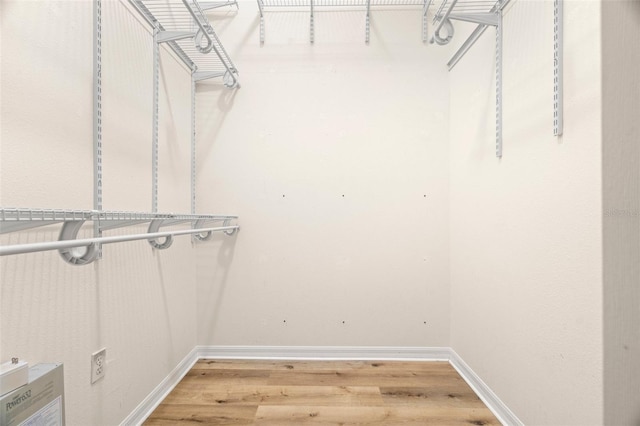 spacious closet with wood finished floors