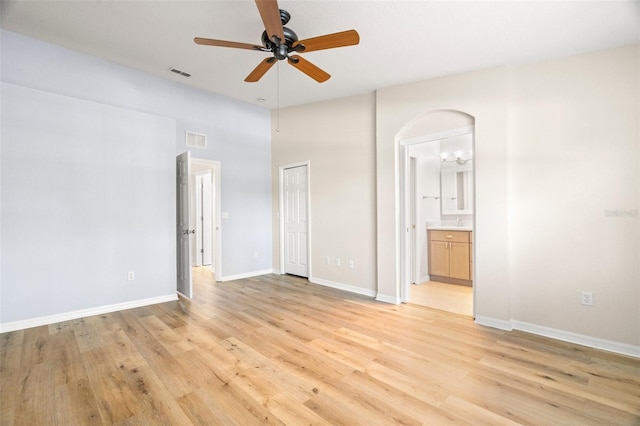 unfurnished bedroom featuring visible vents, baseboards, and light wood-style floors