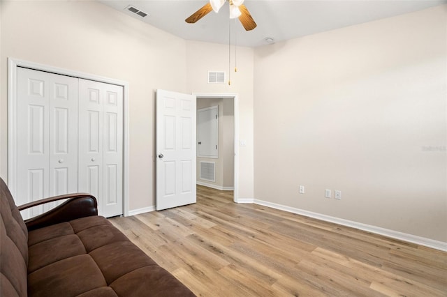 interior space with light wood-style flooring, baseboards, and visible vents