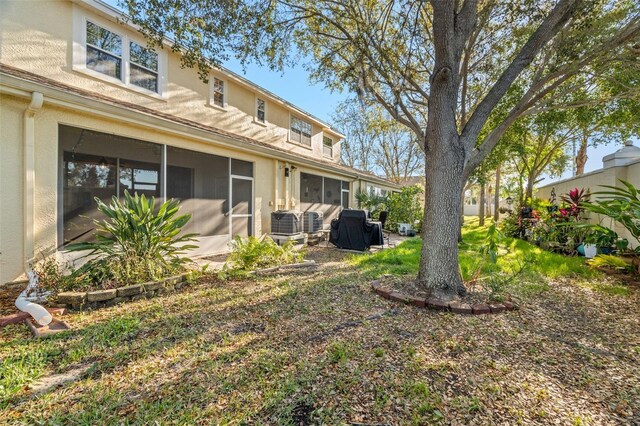 view of yard featuring a sunroom