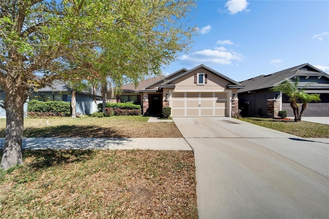 ranch-style house with stucco siding, driveway, stone siding, a front yard, and a garage