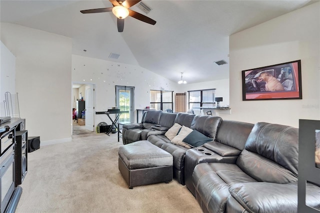 living room with lofted ceiling, visible vents, and light carpet