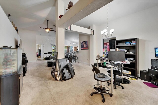 carpeted home office with ceiling fan with notable chandelier, high vaulted ceiling, and baseboards