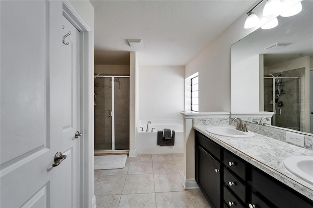 full bath featuring visible vents, a stall shower, a sink, tile patterned flooring, and a bath