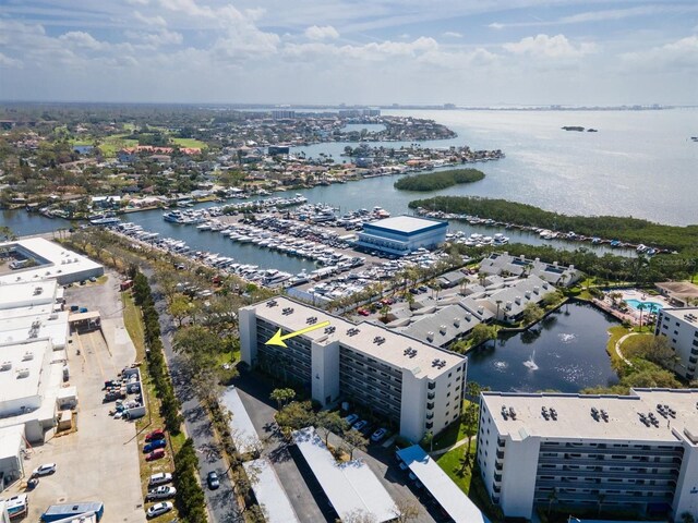 birds eye view of property with a water view