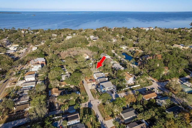 birds eye view of property with a residential view and a water view