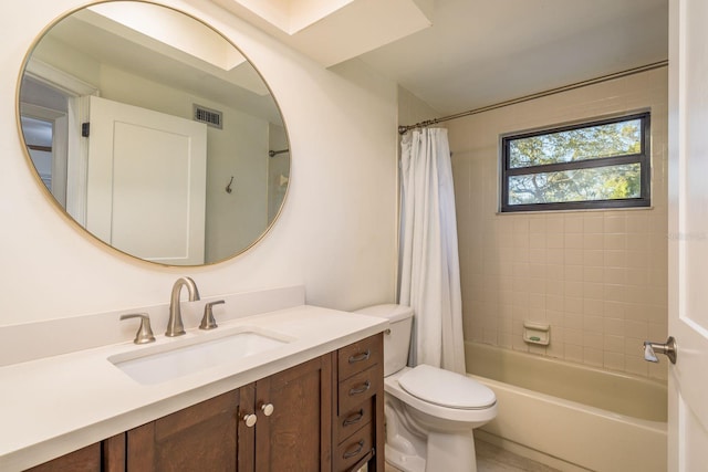 full bathroom with visible vents, shower / tub combo, toilet, and vanity