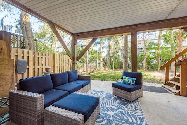 view of patio with an outdoor hangout area and fence