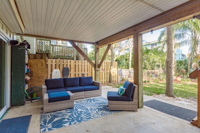 view of patio / terrace with an outdoor living space and fence