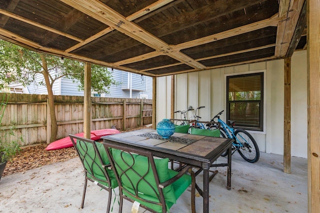 view of patio / terrace featuring outdoor dining space and fence