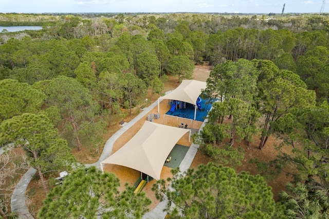 bird's eye view featuring a wooded view