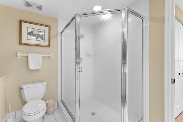 full bathroom featuring tile patterned flooring, a shower stall, toilet, and visible vents