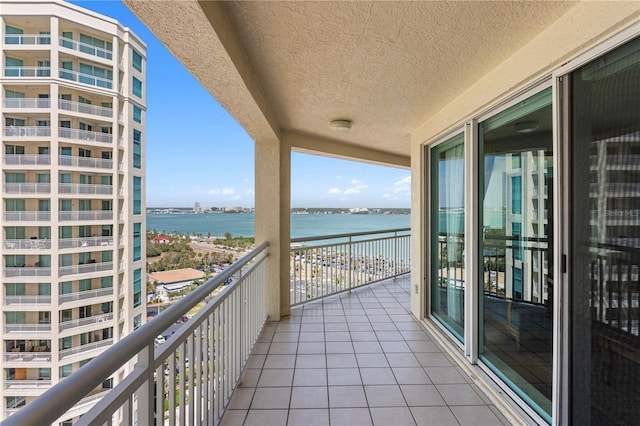 balcony featuring a water view