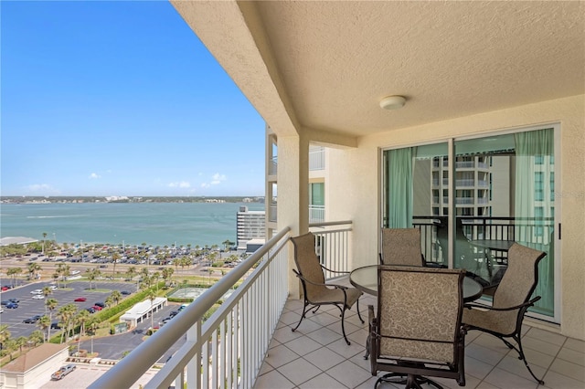 balcony featuring a water view