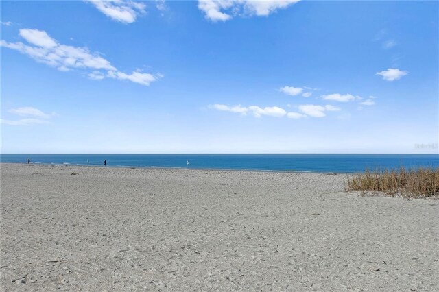 property view of water featuring a beach view
