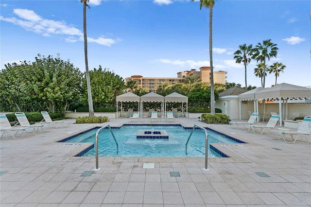 community pool featuring a gazebo and a patio area