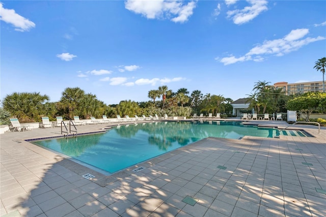 community pool with a patio area
