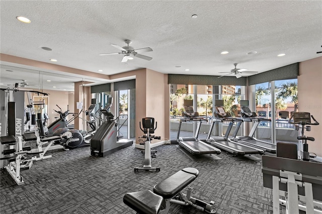 gym with recessed lighting, a ceiling fan, and a textured ceiling
