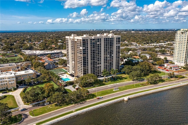 birds eye view of property featuring a water view and a view of city