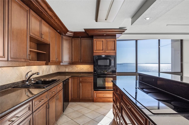 kitchen with light tile patterned floors, open shelves, a sink, black appliances, and tasteful backsplash