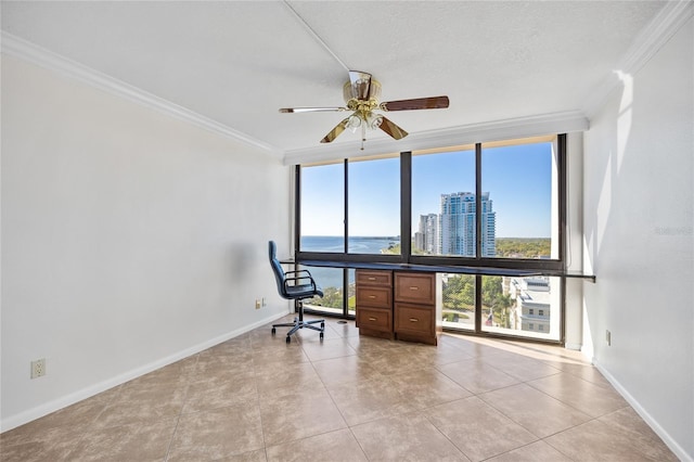 unfurnished room featuring baseboards, crown molding, a ceiling fan, and expansive windows